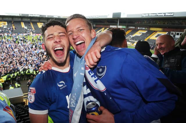 Conor Chaplin and Carl Baker celebrate Pompey’s League Two promotion at Notts County in April 2017. Picture: Joe Pepler