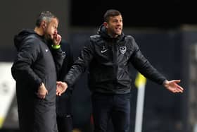 John Mousinho will take on a former Pompey star against Blackpool (Image: Getty Images)