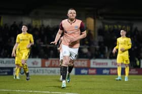 Colby Bishop netted a first-half penalty for Pompey at Burton, only to suffer a worrying ankle injury shortly after. Picture: Jason Brown/ProSportsImages
