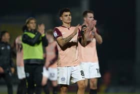 Pompey midfielder Alex Robertson celebrates the Burton Albion win. Pic: Jason Brown