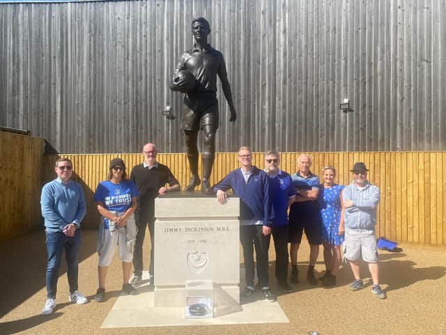 New Trust chairman Donald Vass (centre right) stands next to the Jimmy Dickinson statue, which was unveiled earlier this season.