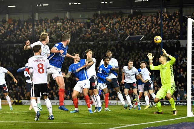 Connor Shaughnessy heads home Pompey's first-half opener against Bolton. Picture: Graham Hunt/ProSportImages