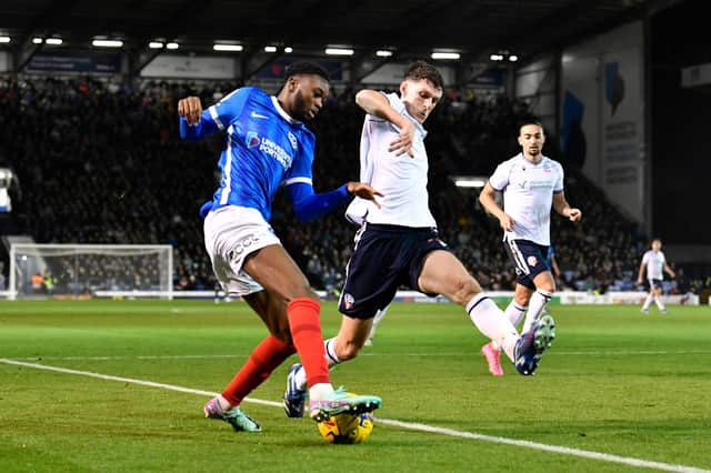 Abu Kamara in action for Pompey v Bolton before his second-half withdrawal because of an ankle injury
