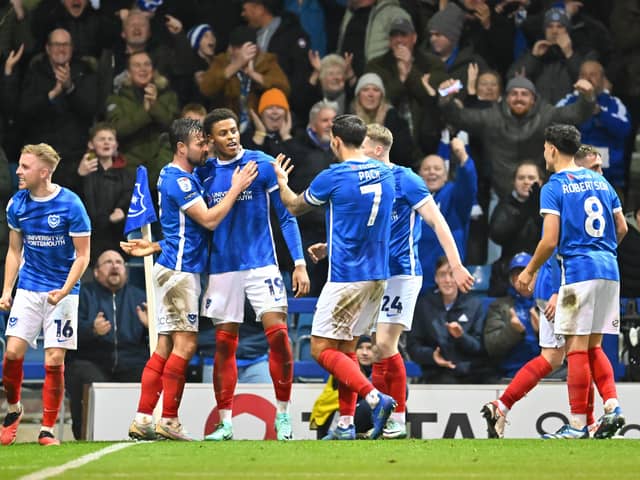 Kusini Yengi is congratulated by his Pompey team-mates following his goal against Bolton on Monday night