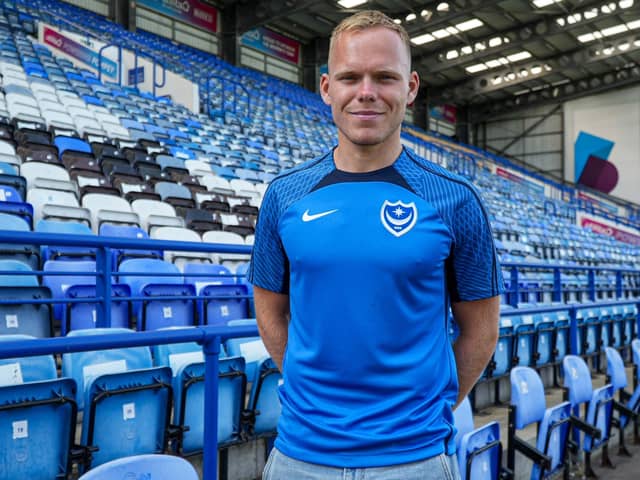 Wigan Athletic signing Anthony Scully is back in Pompey's squad against AFC Wimbledon.