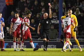 Nathan Thompson heads straight for the Fratton Park changing room after being dismissed by referee Charles Breakspear for his high-foot challenge on Christian Saydee
