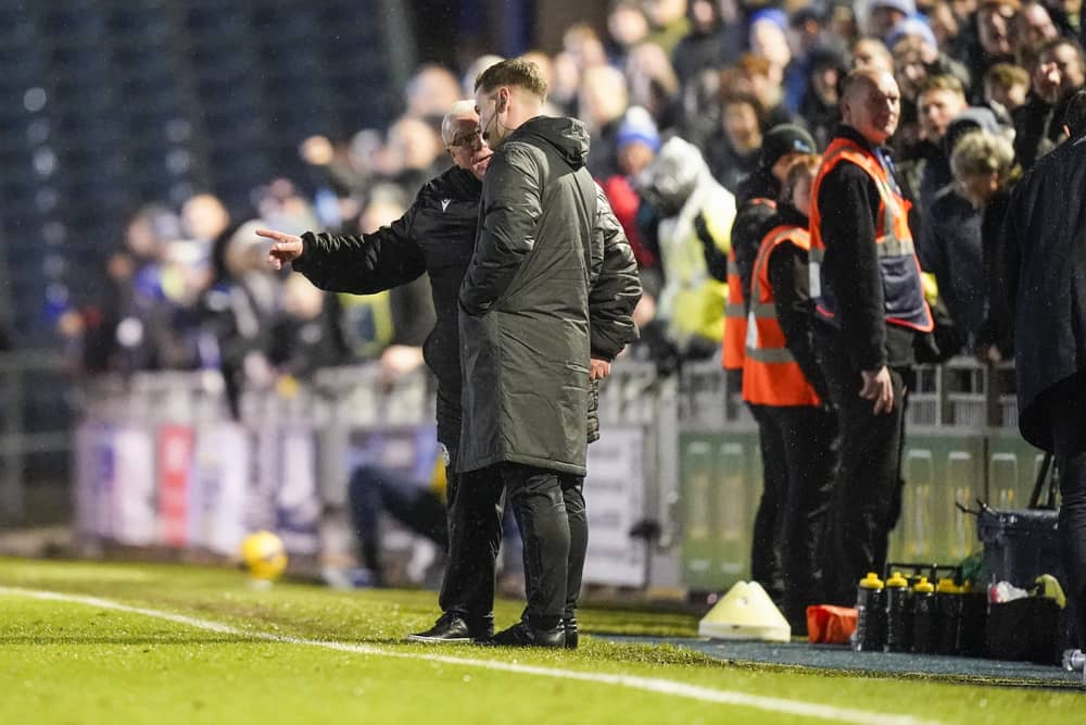 Steve Evans confronts the fourth official in Stevenage's 2-1 loss at Pompey. Pic: Jason Brown/ProSportsImages