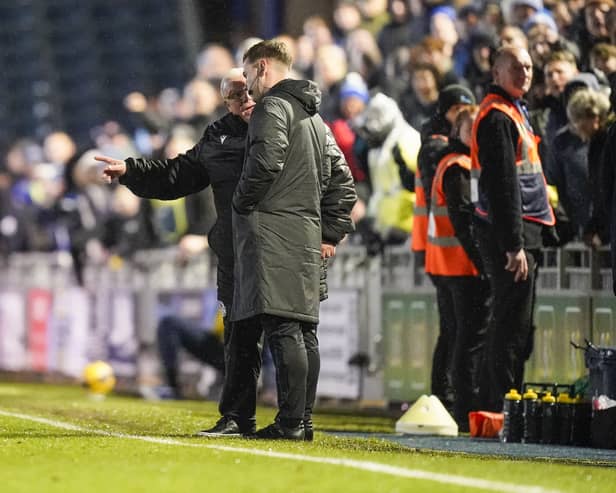 Steve Evans confronts the fourth official in Stevenage's 2-1 loss at Pompey. Pic: Jason Brown/ProSportsImages
