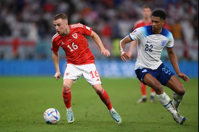 Joe Morrell gets the better of England's Jude Bellingham in the 2022 World Cup finals in Qatar. Picture: Justin Setterfield/Getty