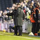 Stevenage boss Steve Evans confronts the fourth official after seeing both Nathan Thompson and Paul Raynor sent off at Fratton Park on New Year's Day