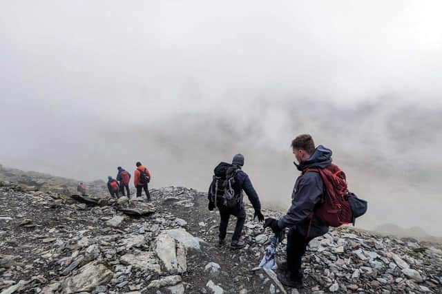 Aircraft engineers from Portsmouth tackling Snowdonia in Wales.