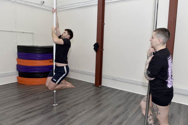 The News, Portsmouth reporter Joe Buncle has a go at pole dancing.