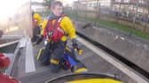 An RNLI crew has rescued a cat after it managed to get stcuk under a pontoon at East Cowes Marina. 
Pictured: The cat jumping to safety from the pontoon after being rescued. 