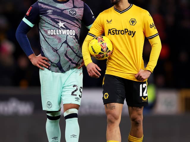 Pompey target Myles Peart-Harris, left, was in FA Cup action for Brentford on Tuesday night at Wolves. Pic: Getty.
