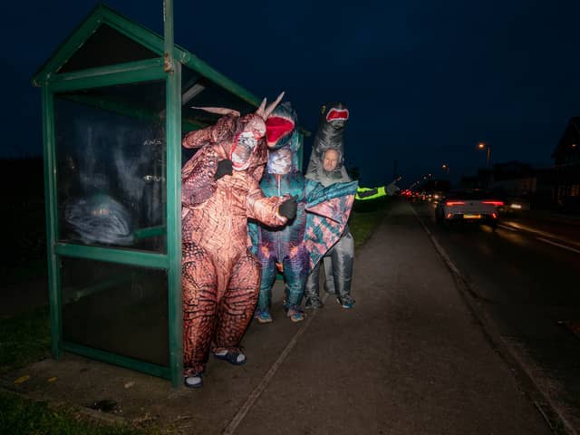 Graeme Lloyd and his friends are walking 15,000 steps a day in January in support of the Motor Neurones Disease Association. They are doing it in 8f inflatable dinosaur costumes. Pictured: Graeme Lloyd (tetradactyl), Tommy Russell (triceratops) and Steven Porter (brontosaurus) 