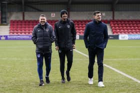John Mousinho, left, with Jon Harley and Zesh Rehman at Fleetwood before kick-off