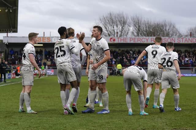 Abu Kamara is congratulated following his winner for Pompey at Fleetwood