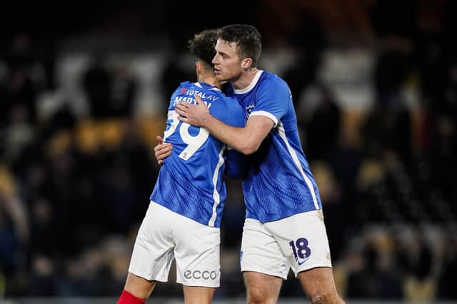 Conor Shaughnessy embraces Josh Martin following Pompey's late win at Port Vale. Picture: Jason Brown/ProSportsImages