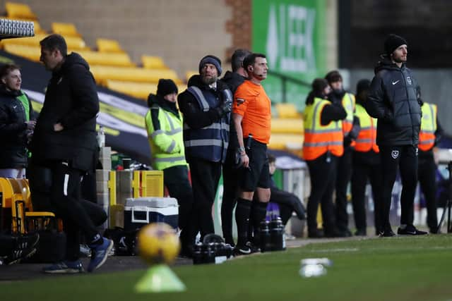 Referee Craig Hicks runs off the pitch after being chased by a Port Vale fan during the Sky Bet League One match at Vale Park, Stoke-on-Trent. Picture date: Saturday January 27. Picture: jess Horny/PA Wire