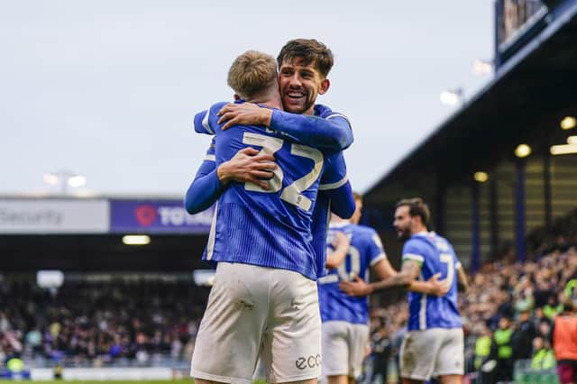 The architect of Pompey's third goal against Northampton - Callum Lang - embraces the scorer - Paddy Lane. Picture: Jason Brown/ProSportsImages