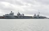 HMS Queen Elizabeth and HMS Prince of Wales alongside each other. Picture: Sarah Standing (060224-6529)