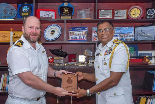 Cdr Caddy, Commanding Officer of HMS Spey, presenting a Spey memento to a senior Sri Lankan officer. Picture: Royal Navy/MoD Crown Copyright