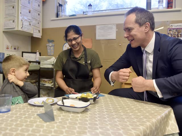 Pictured is: David Johnston speaks to David Tului (4) and Anne Perera, casual practitioner.