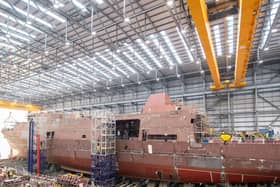 HMS Venturer, one of the Royal Navy's new Type 31 frigates, being raised on jacks at Rosyth in Scotland. Picture: Royal Navy.