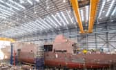 HMS Venturer, one of the Royal Navy's new Type 31 frigates, being raised on jacks at Rosyth in Scotland. Picture: Royal Navy.