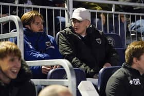 Ronan Curtis on the AFC Wimbledon bench during the Dons' EFL Trophy win against Pompey at Fratton Park in December