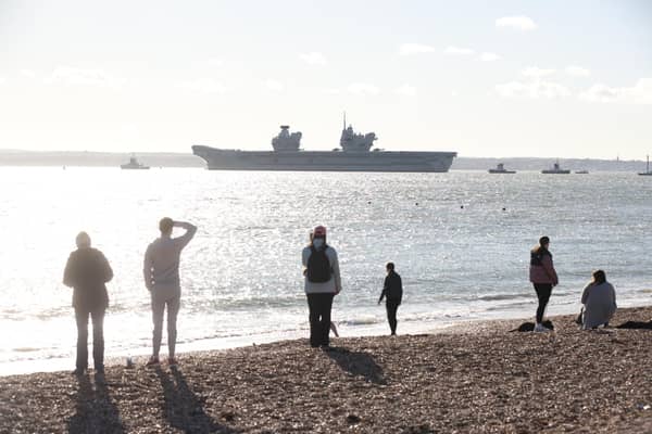 HMS Prince of Wales leaving Portsmouth for a huge Nato mission in the North Sea. Residents crowded round Old Portsmouth to watch her leave. Picture: Sam Stephenson.