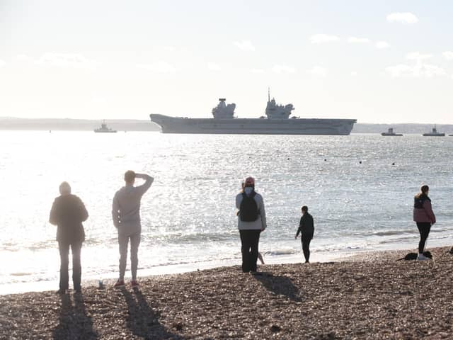 HMS Prince of Wales leaving Portsmouth for a huge Nato mission in the North Sea. Residents crowded round Old Portsmouth to watch her leave. Picture: Sam Stephenson.