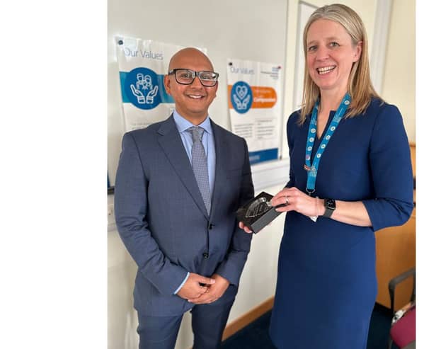 Dr Kaushik Guha is presented the award by Chief Executive of Portsmouth Hospitals University NHS Trust, Penny Emerit
