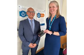Dr Kaushik Guha is presented the award by Chief Executive of Portsmouth Hospitals University NHS Trust, Penny Emerit