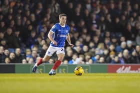 Tom Lowery is action for Pompey against Cambridge United before picking up his hamstring injury