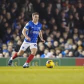 Tom Lowery is action for Pompey against Cambridge United before picking up his hamstring injury