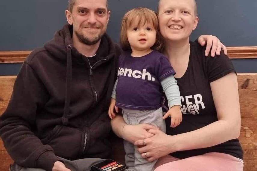 Rebecca Sermon with her daughter, Aria, and husband Max, whose gift of a fidget ring inspired her to start a new small business.