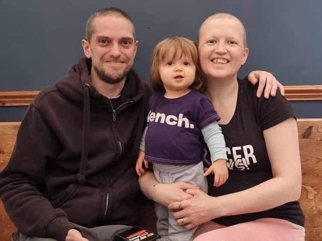Rebecca Sermon with her daughter, Aria, and husband Max, whose gift of a fidget ring inspired her to start a new small business.
