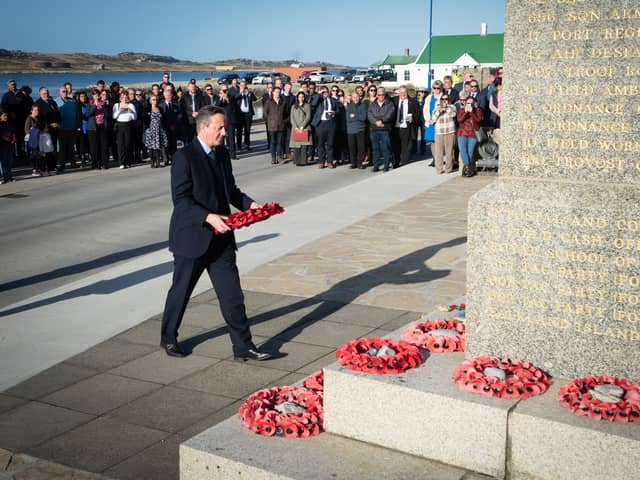 Foreign Secretary Lord David Cameron attends a wreath laying ceremony at the Falklands conflict memorial in Port Stanley on the Falkland Islands, during his high-profile visit to demonstrate they are a "valued part of the British family" amid renewed Argentinian calls for talks on their future. Picture: Stefan Rousseau/PA Wire.