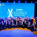 The News Business Excellence Awards winners 2024 line up on the stage after an evening of celebration.