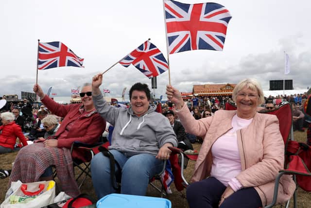 Residents watching the commemorations on the big screen at D-day 75