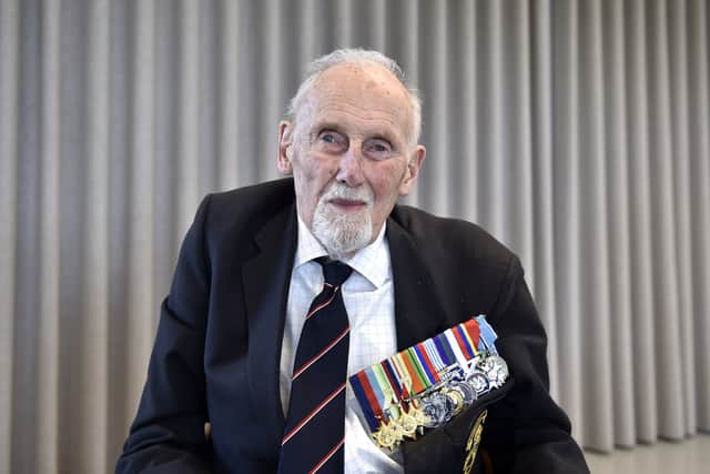 Pictured is: John Roberts, 99, of Kent, D-Day veteran and Royal Navy rear admiral who served on HMS Serapis. Picture: Sarah Standing (270224-7891)