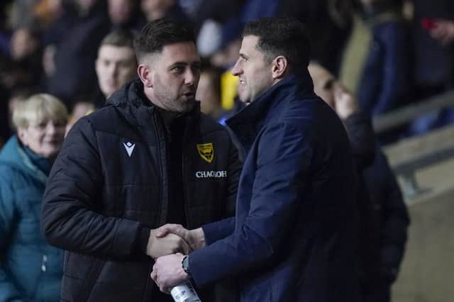 Pompey boss John Mousinho and Oxford United Des Buckingham following January's 2-2 draw. Picture: Jason Brown/ProSportsImages