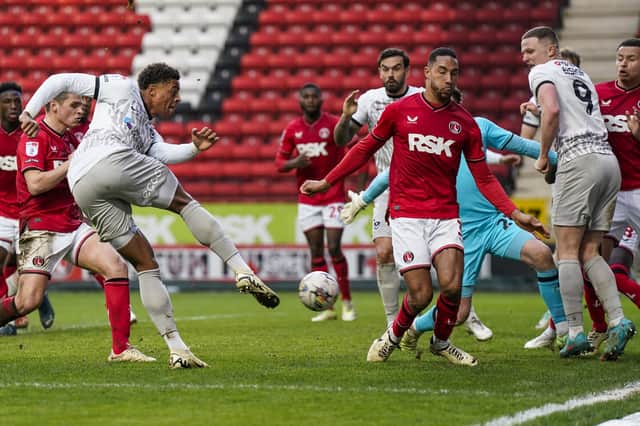 Kusini Yengi fires in a shot against Charlton, with striking rival Colby Bishop trying to get out of the way. Picture: Jason Brown/ProSportsImages