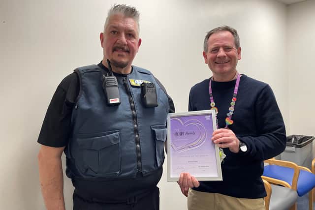 
Security officer Anthony Evans receives his colleague of the month award from Solent NHS Trust chief executive Andrew Strevens

