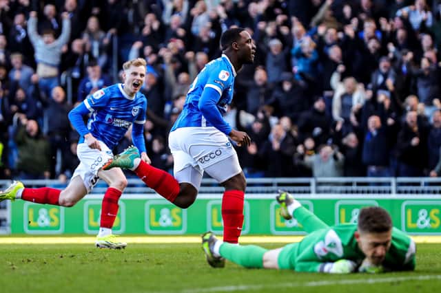 Christian Saydee celebrates his Pompey winner against Oxford United - and Will Norris wanted to join him! Picture: PA
