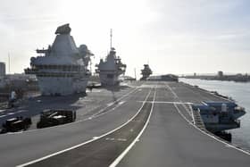 HMS Queen Elizabeth was due to leave Portsmouth and head for Rosyth in Scotland today, but that has now been delayed. The aircraft carrier is returning to where she was built after a shaft coupling fault was found. Picture: Sarah Standing (010224-6165)