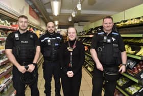 Pictured is: Daisy Potter, manager at Sainsbury's Local in Guildhall Walk, Portsmouth, with (l-r) PC Jonathan Tallent, PCSO Georgi Berkov and Sgt Paul Marshall.
