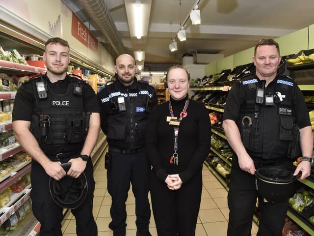 Pictured is: Daisy Potter, manager at Sainsbury's Local in Guildhall Walk, Portsmouth, with (l-r) PC Jonathan Tallent, PCSO Georgi Berkov and Sgt Paul Marshall.
