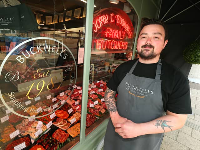 Butcher Tom Bridle with the window display. Buckwells of Southsea, Osborne Road, Southsea Picture: Chris Moorhouse (jpns 170523-04)